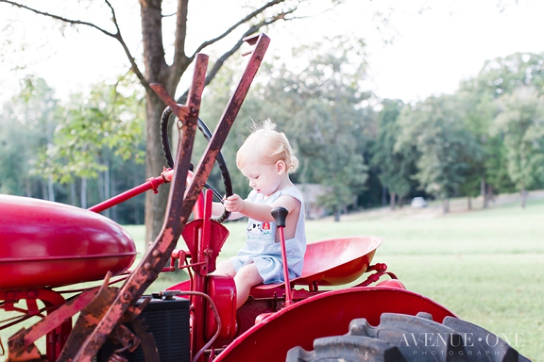 little boy on red tractor