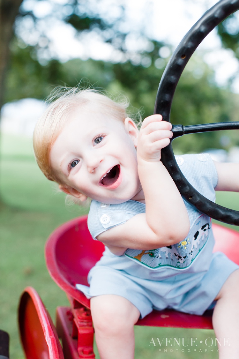 cute little boy peeking at camera