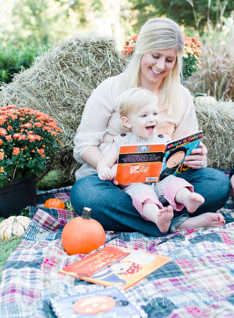 little boy laughing at pumpkin book
