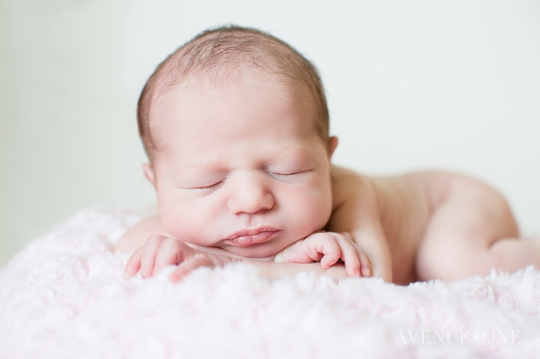 newborn photo with baby holding head up