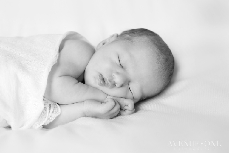 newborn face scrunched up sleeping