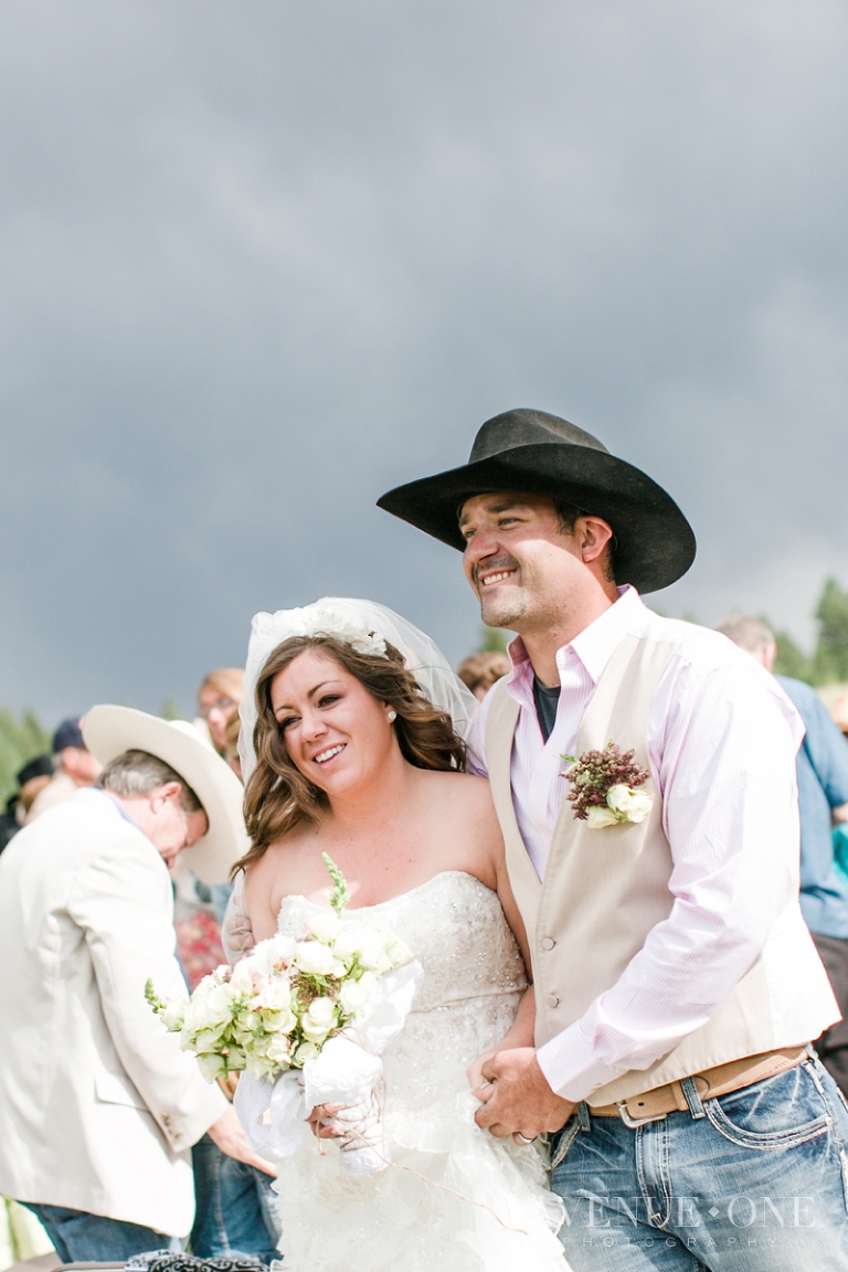 bride and groom just married walking down aisle