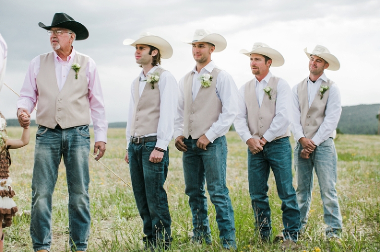 groomsmen in jeans and cowboy hats