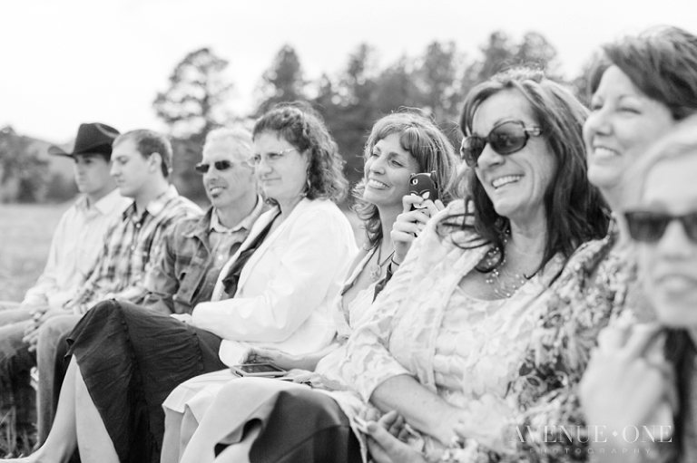 family watching bride and groom during ceremony