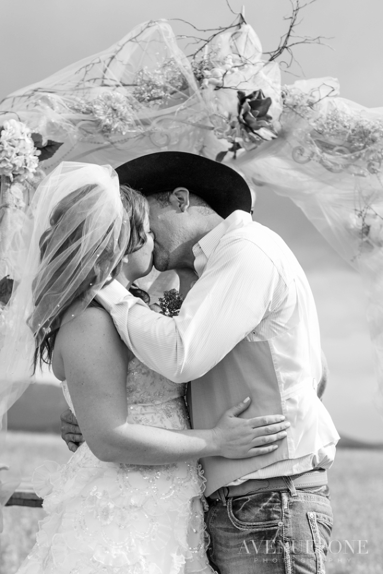 cowboy bride and groom first kiss