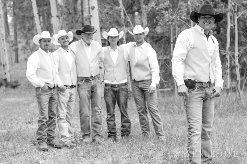 cowboy groom in front with groomsmen behind