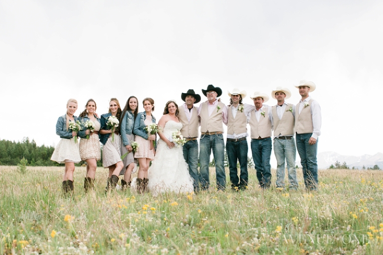 cowboy bridal party in field