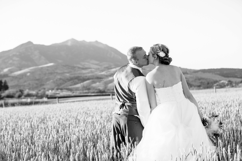 bride and groom with mountains in the background