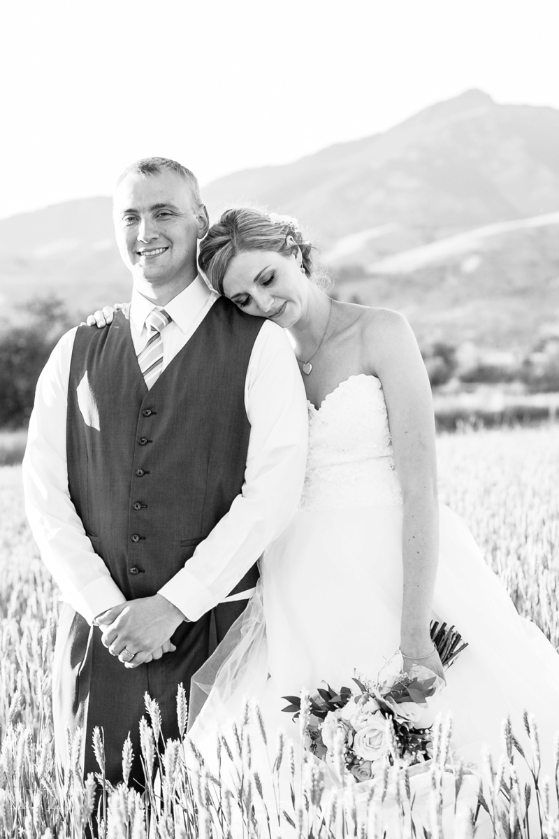 bride resting head on groom's shoulder