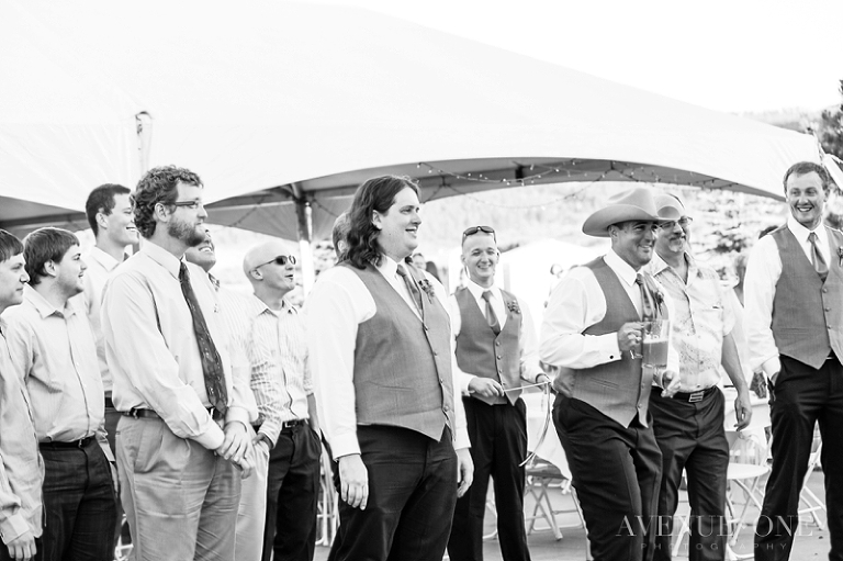 groomsmen waiting for garter toss