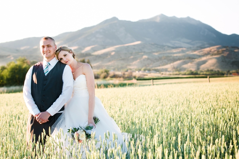 editorial bride and groom in field