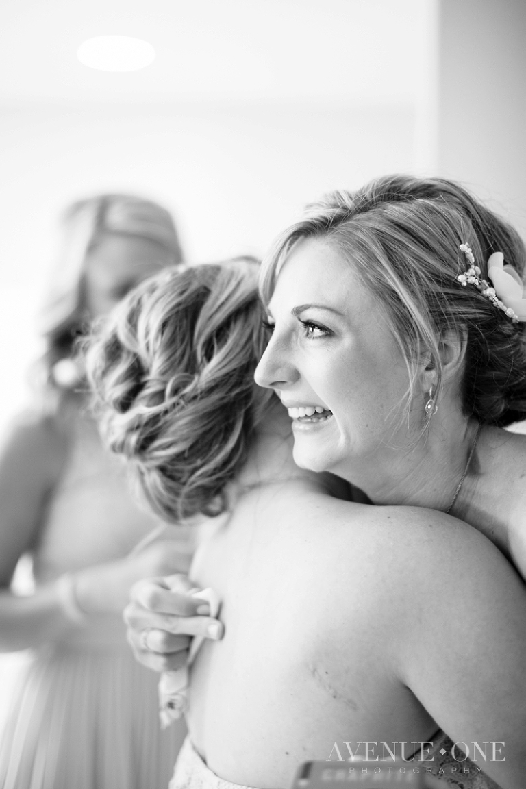 bride hugging bridesmaid