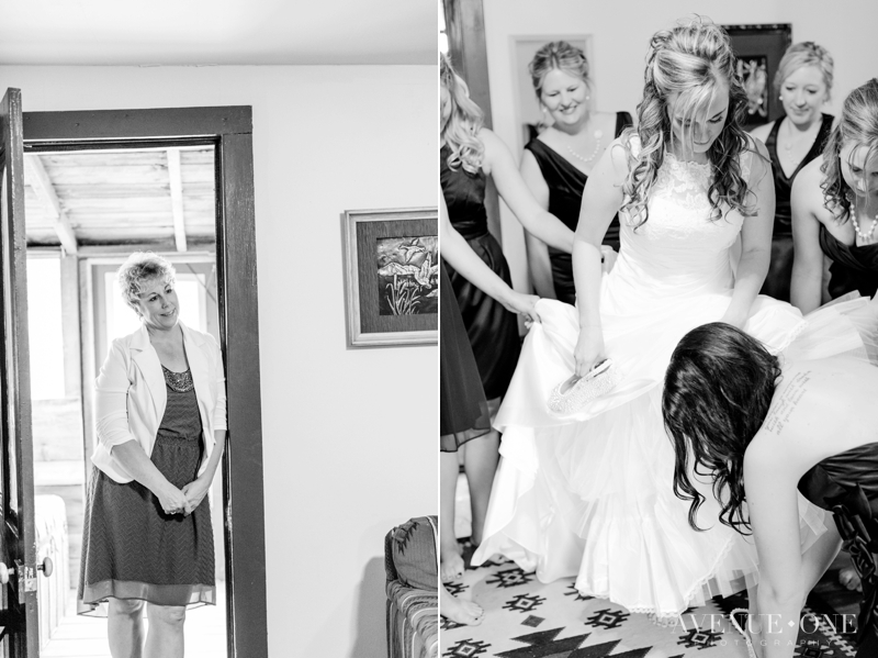 bride putting on shoes with bridesmaids