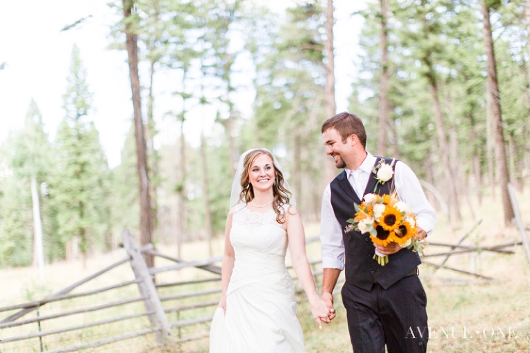 bride and groom walking together laughing