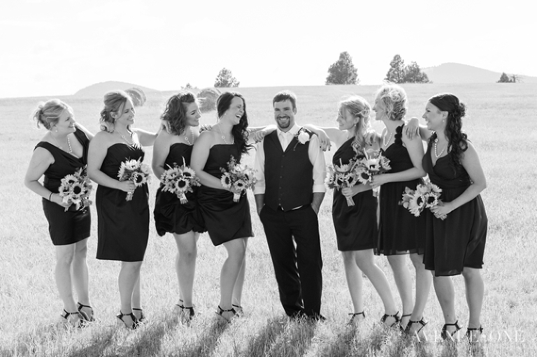 bridesmaids with groom in field