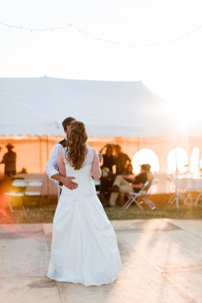 first dance with sun flare in tent