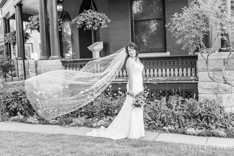 bride with veil blowing in wind