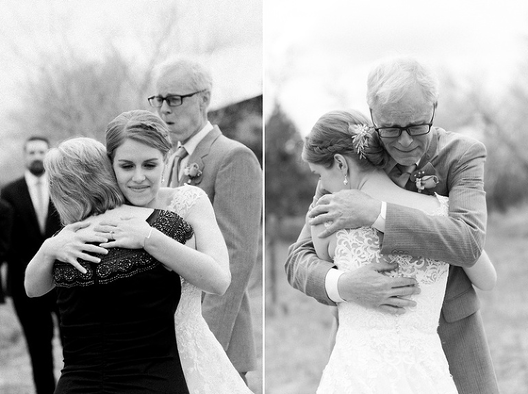 Bride hugging parents at alter