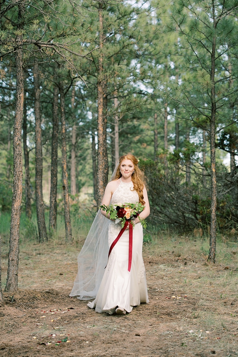bride-walking-down-aisle-at-summer-star-ranch-wedding-helena-mt