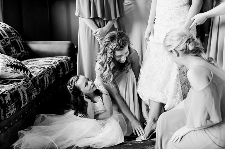 Flower-girl-looking-at-bride-getting-ready